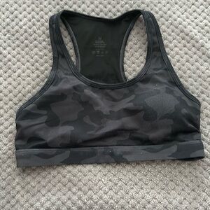 Woman black camo sports bra.